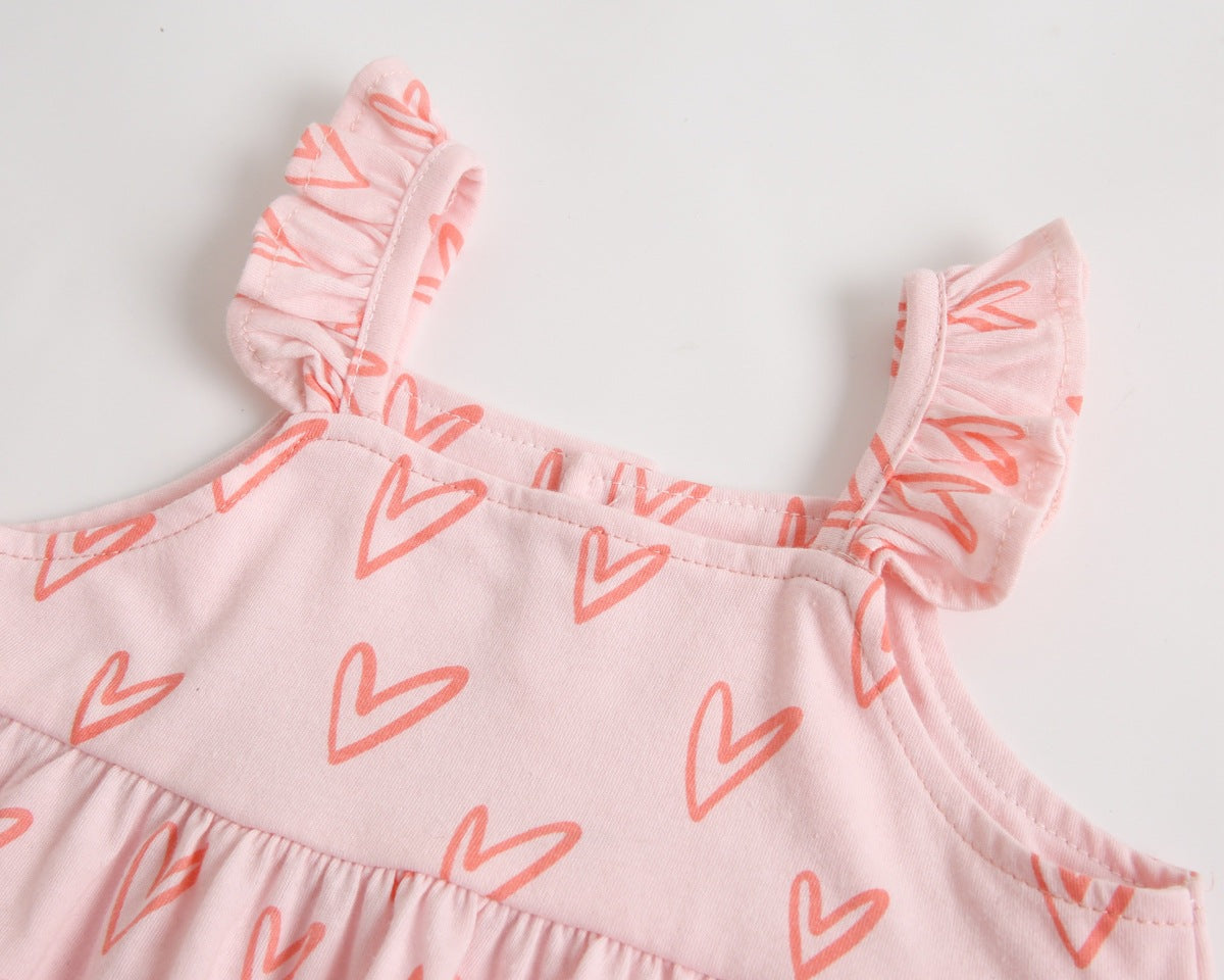 Adorable baby girl outfit featuring a ruffle sleeveless top and matching shorts with a heart printed pattern in pink and yellow.