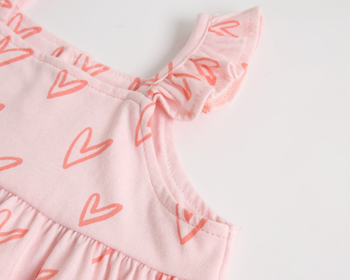 Adorable baby girl outfit featuring a ruffle sleeveless top and matching shorts with a heart printed pattern in pink and yellow.