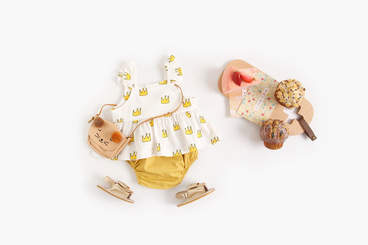 Adorable baby girl outfit featuring a ruffle sleeveless top and matching shorts with a heart printed pattern in pink and yellow.