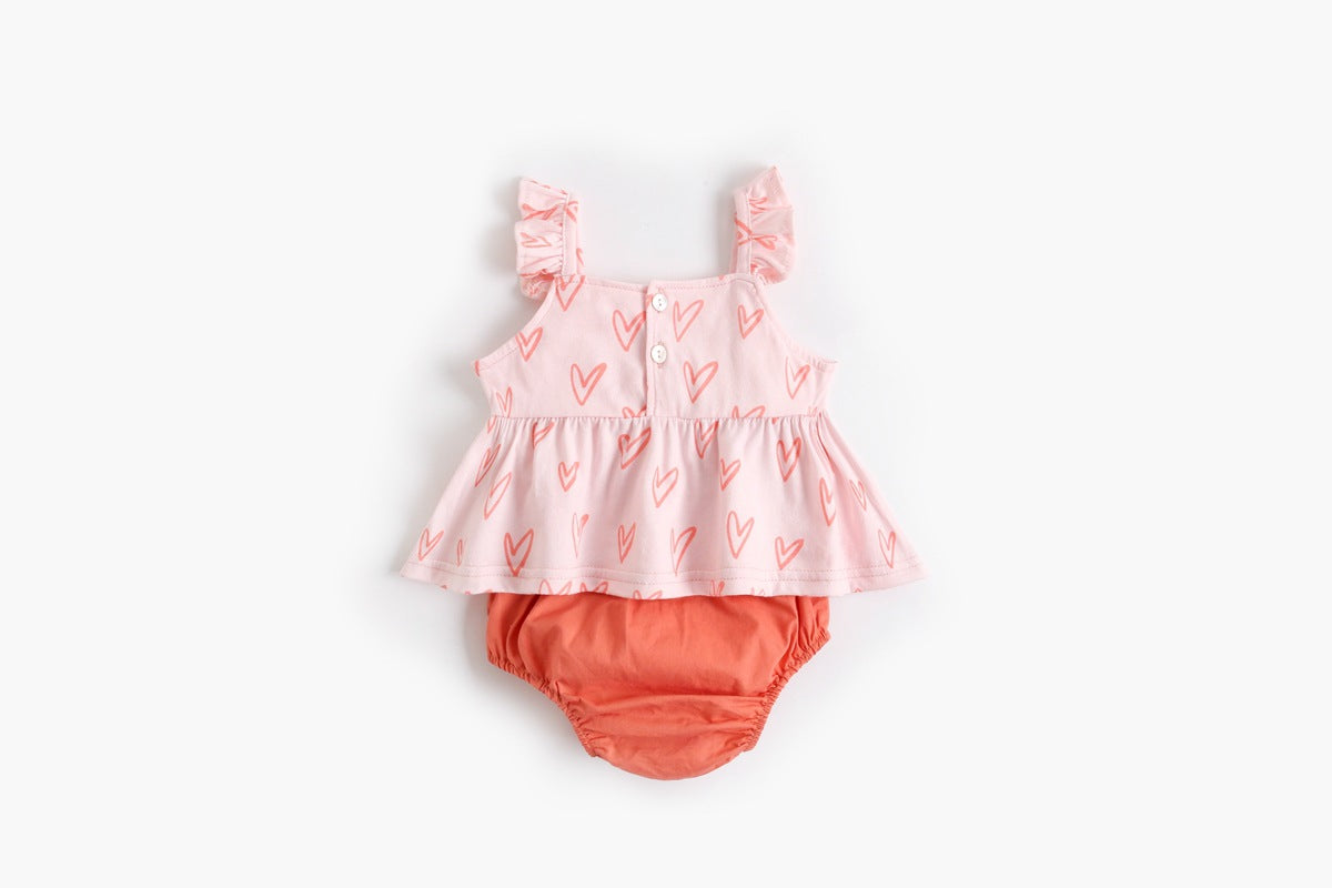 Adorable baby girl outfit featuring a ruffle sleeveless top and matching shorts with a heart printed pattern in pink and yellow.