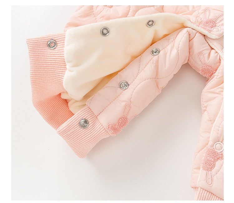 Baby girl wearing a pink rabbit cartoon romper with a Peter Pan collar, showcasing a playful design suitable for all seasons.