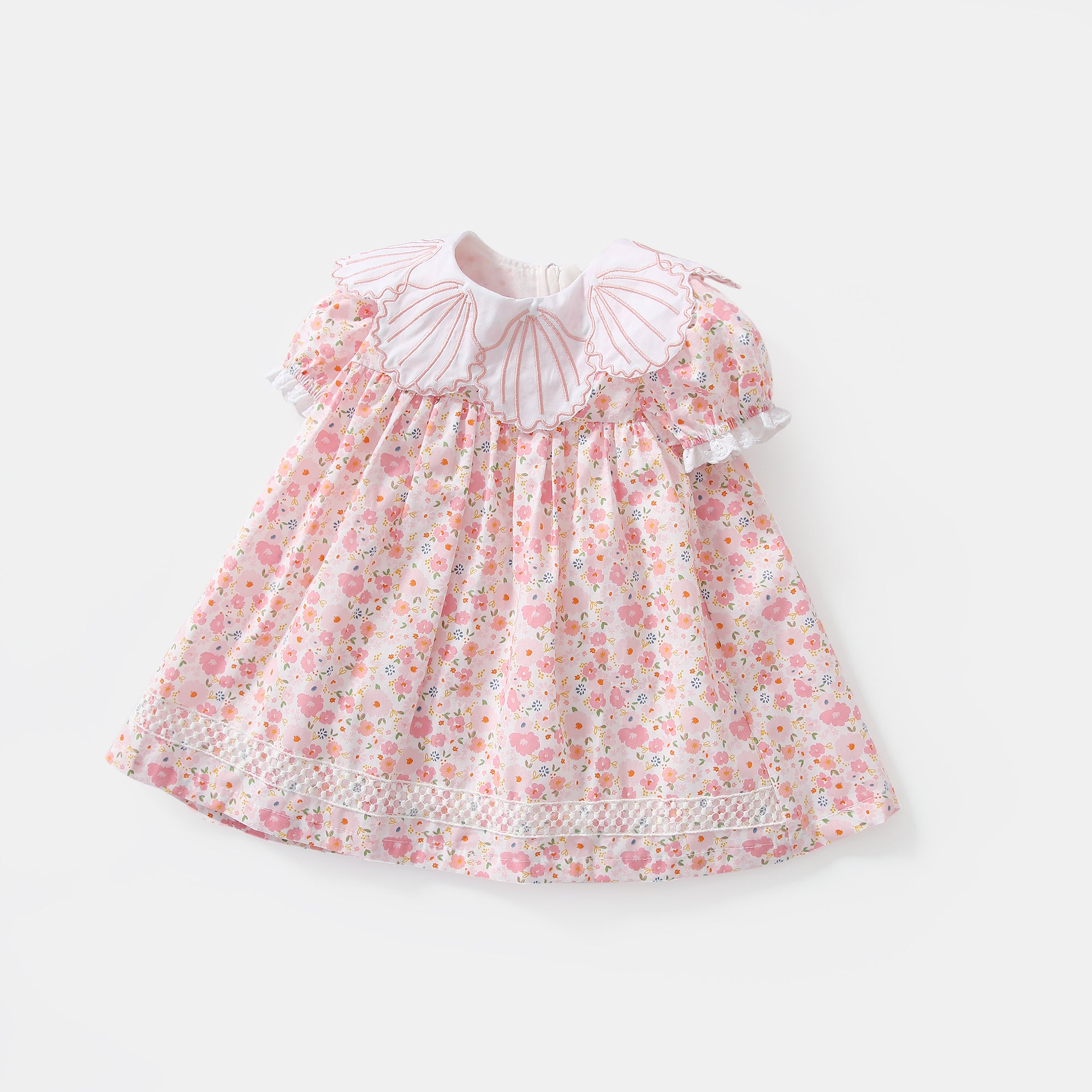 Baby girl dress featuring a floral print and shell shape collar, perfect for summer occasions.