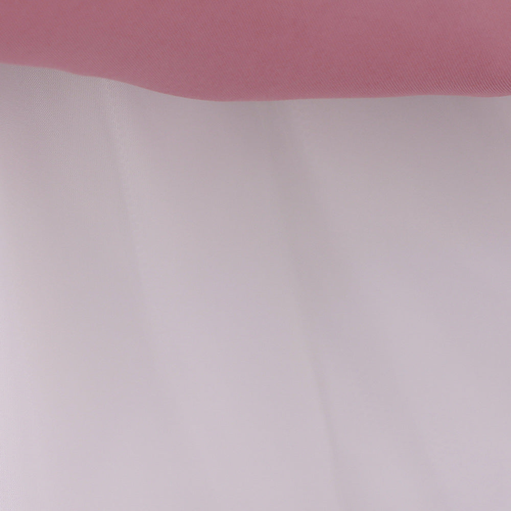 A cute baby girl wearing a solid color sleeveless dress with a bow patch, showcasing vibrant colors and a stylish design.