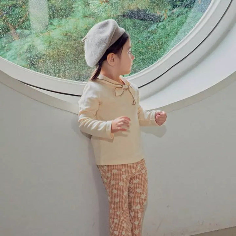 Baby girl long sleeve pullover top with solid color and bow tie design, available in white and coffee, made from soft cotton material.