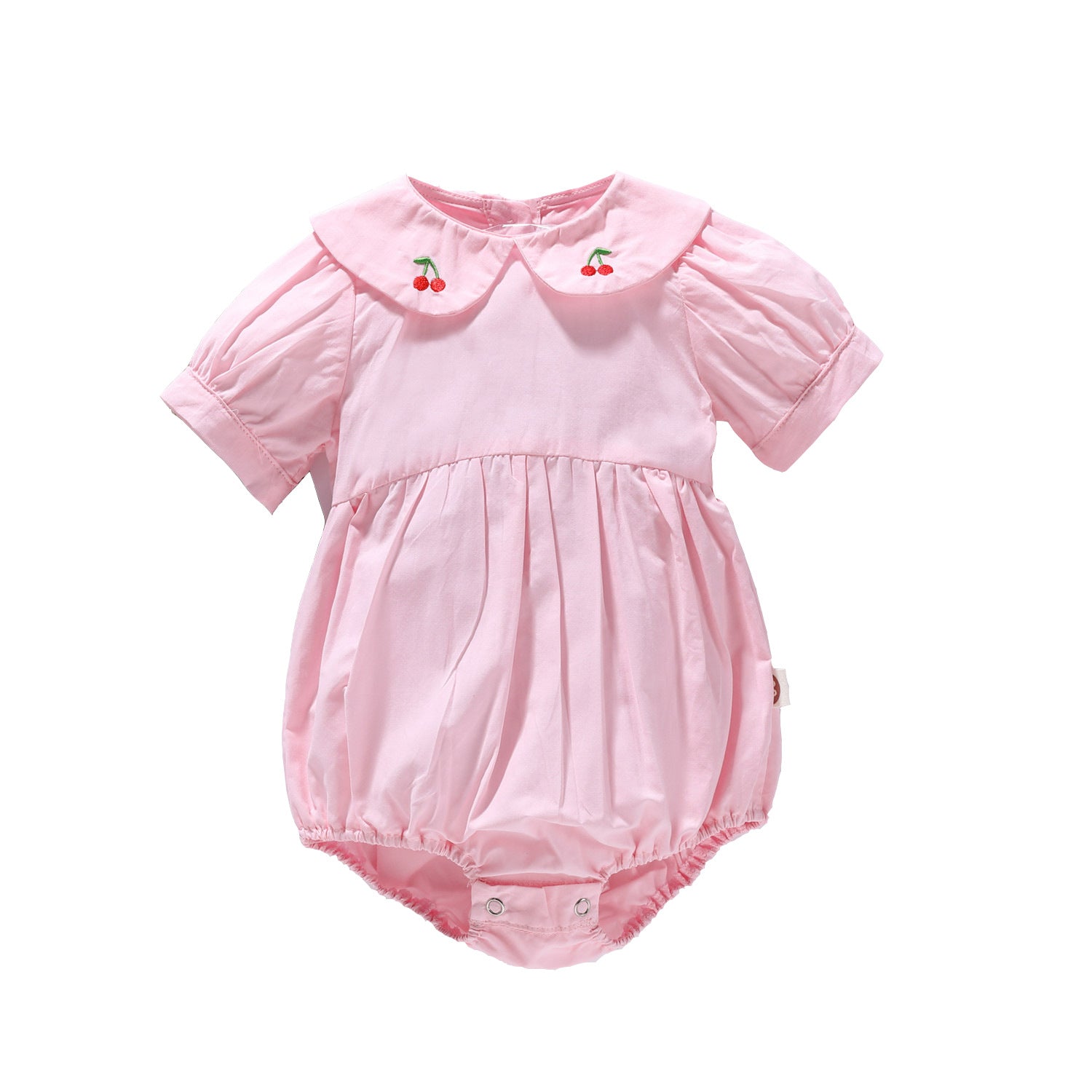 Baby girl onesie featuring cherry embroidery and puff sleeves in white and pink colors, made from soft cotton fabric.