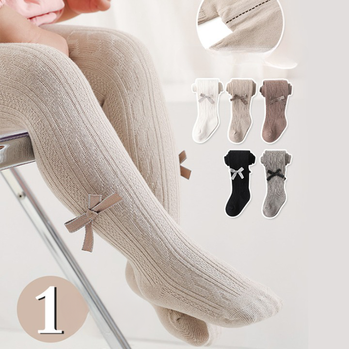 A pair of Baby Girl Solid Color Covered Leggings in various colors, showcasing their soft cotton material and elastic waistband.