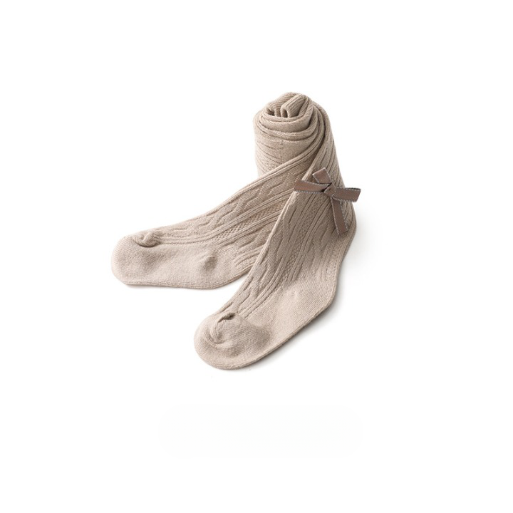 A pair of Baby Girl Solid Color Covered Leggings in various colors, showcasing their soft cotton material and elastic waistband.