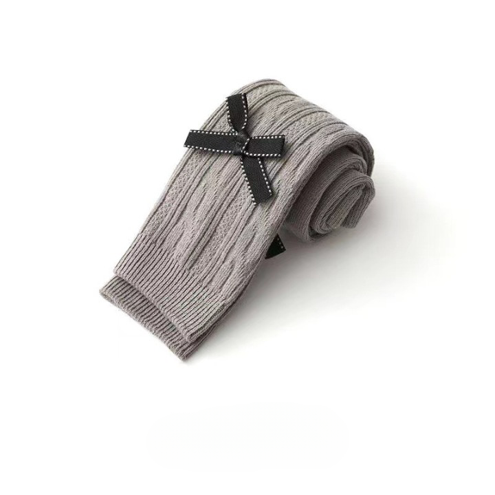 A pair of Baby Girl Solid Color Covered Leggings in various colors, showcasing their soft cotton material and elastic waistband.