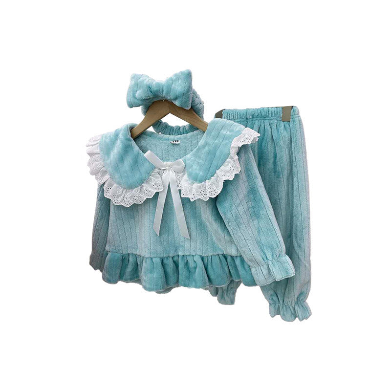 Baby girl wearing a solid color doll neck fleece tracksuit in pink, featuring thickened tops and trousers, perfect for winter.