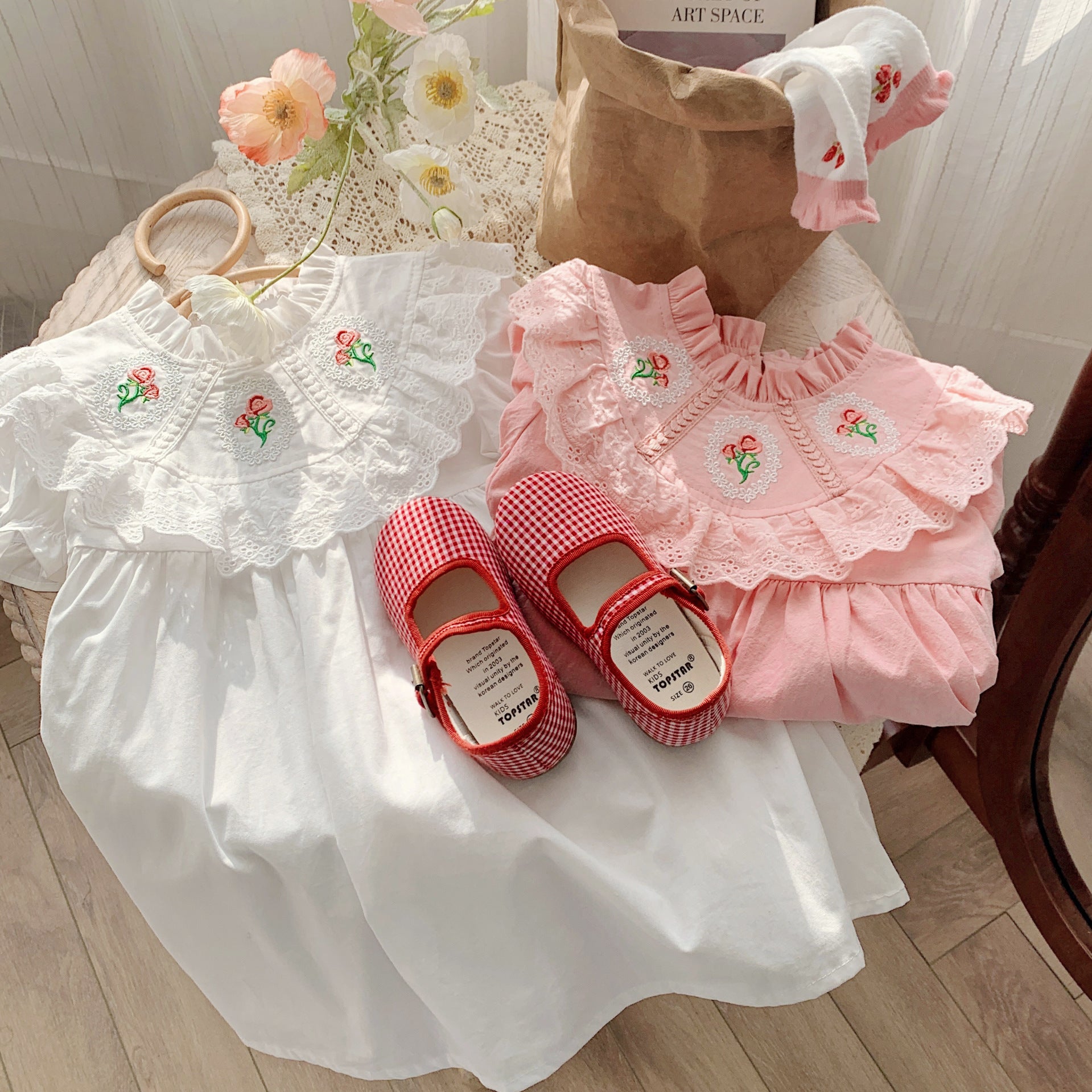 Baby Girl Solid Color Embroidered Pattern Loose Dress in white and pink, showcasing floral embroidery and a loose fit for comfort.