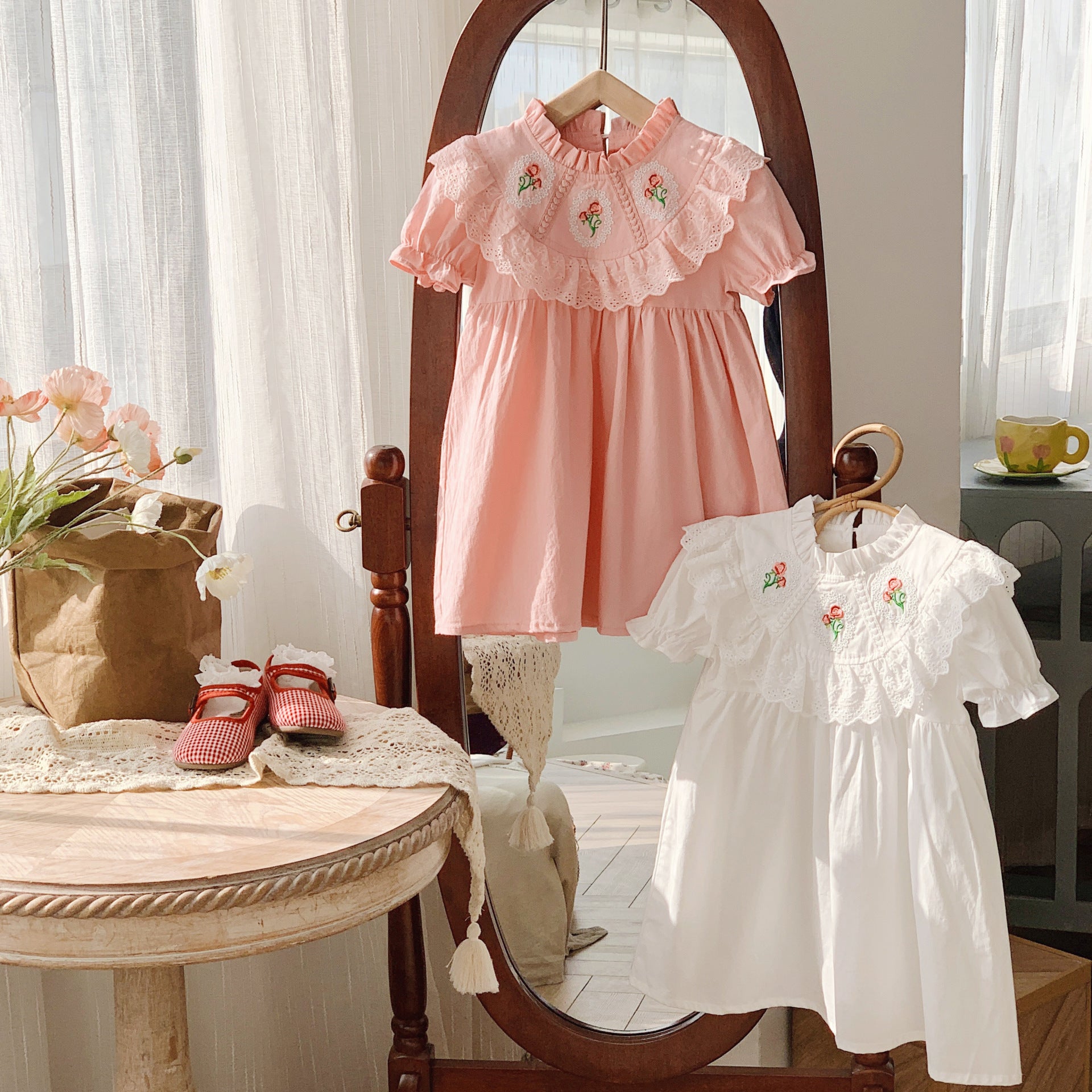 Baby Girl Solid Color Embroidered Pattern Loose Dress in white and pink, showcasing floral embroidery and a loose fit for comfort.