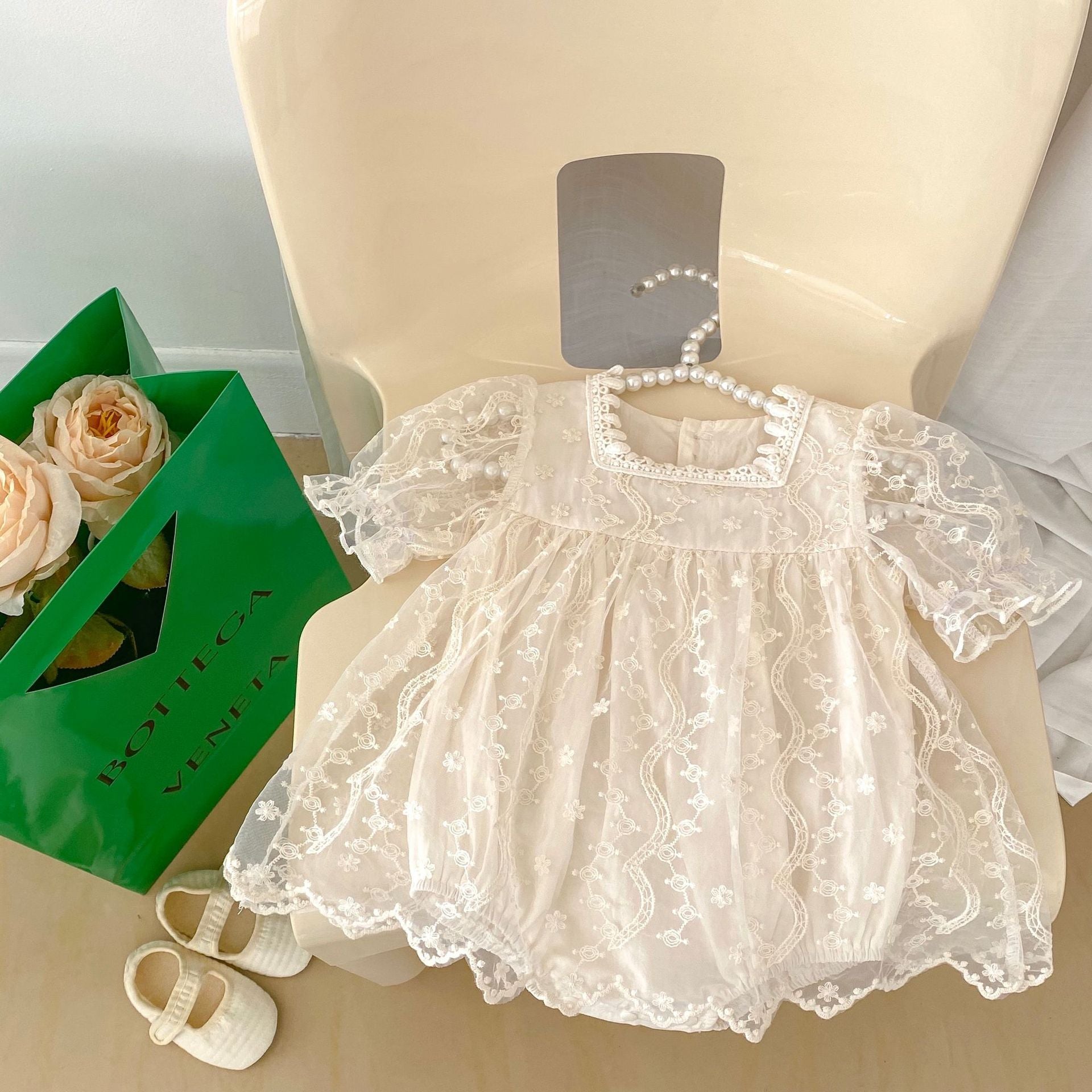 Baby girl dress featuring solid color, floral embroidery, and mesh design, perfect for summer occasions.