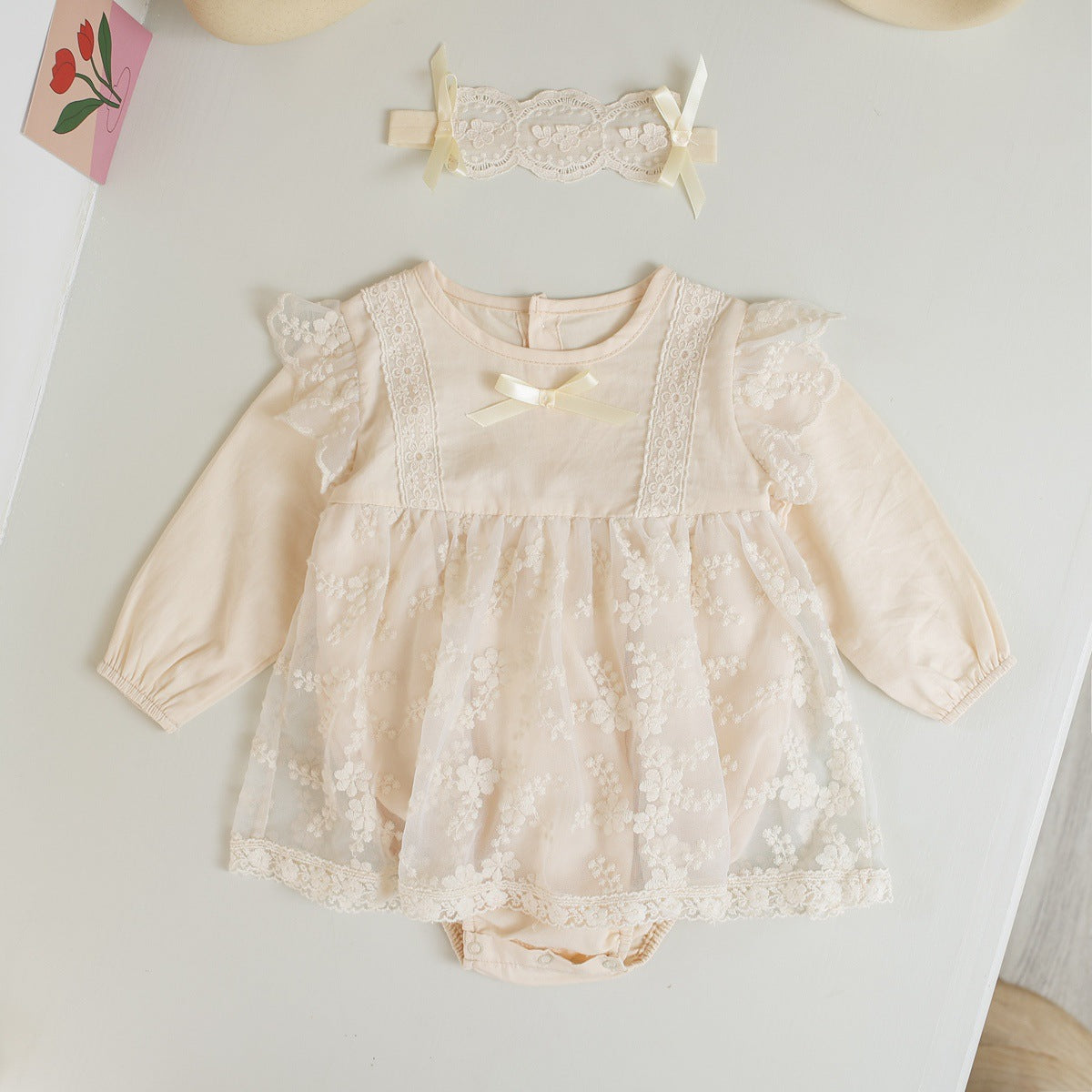 Baby girl onesie featuring solid color with floral embroidery and mesh overlay, perfect for spring and autumn wear.