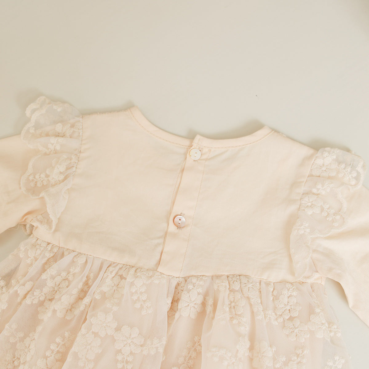 Baby girl onesie featuring solid color with floral embroidery and mesh overlay, perfect for spring and autumn wear.