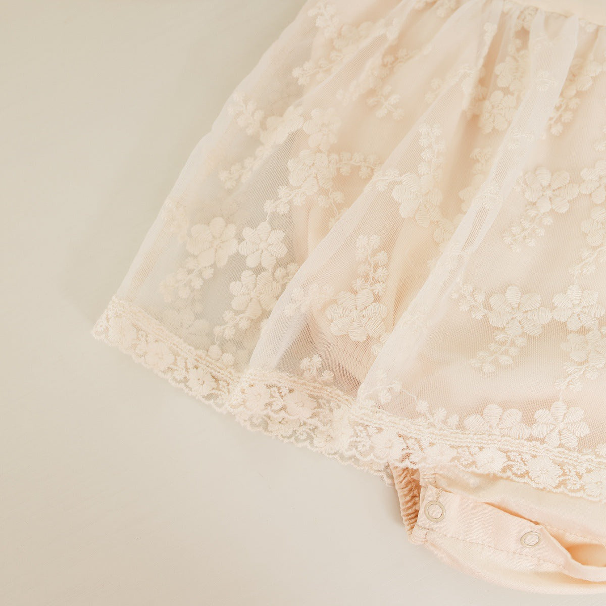 Baby girl onesie featuring solid color with floral embroidery and mesh overlay, perfect for spring and autumn wear.