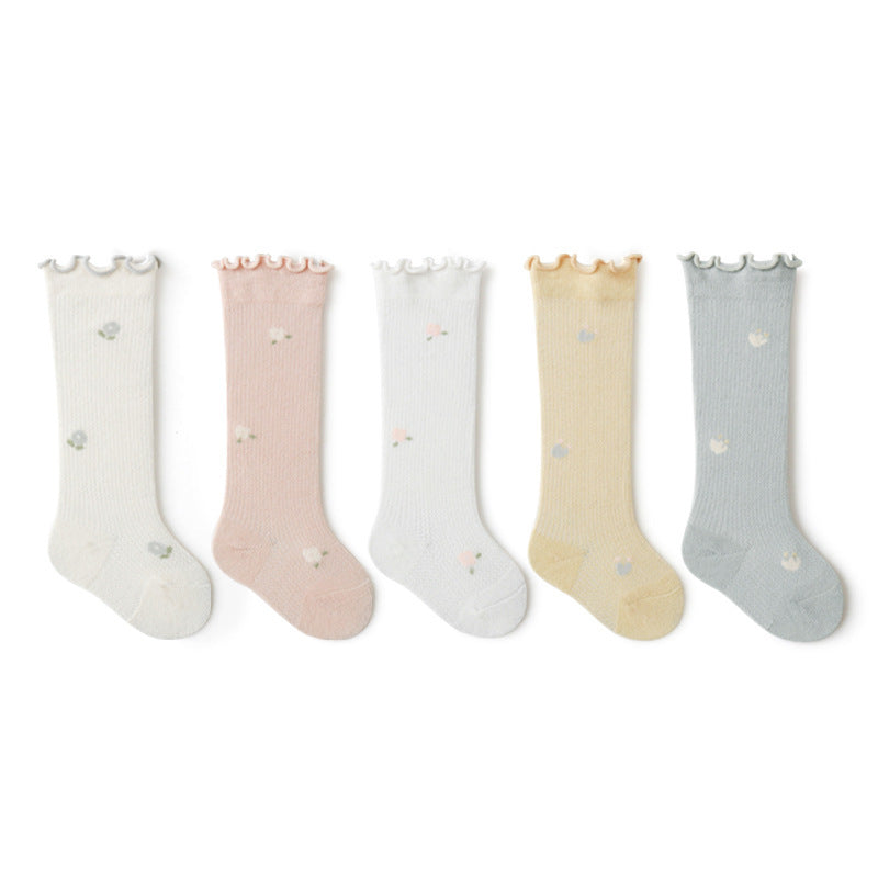 Baby girl knee socks with floral embroidery in various solid colors, made from breathable cotton.