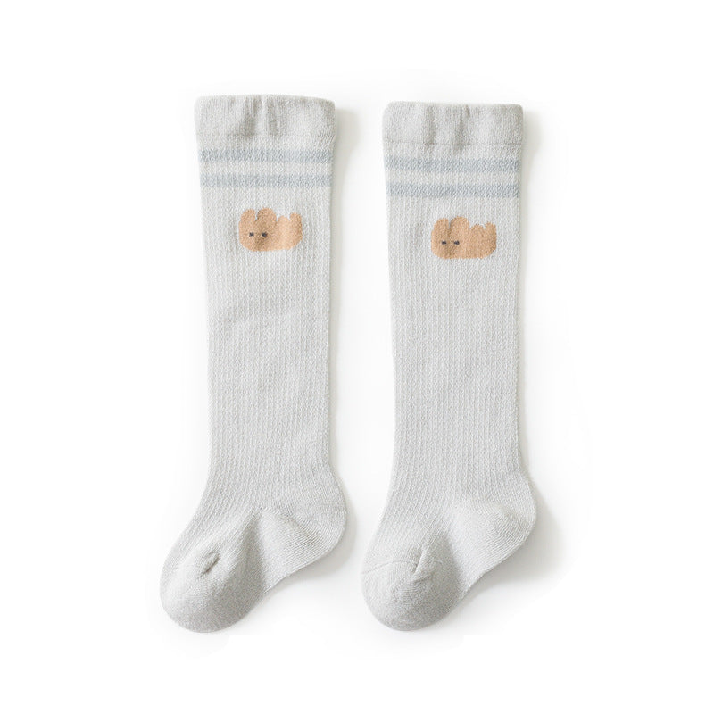 Baby girl knee socks with floral embroidery in various solid colors, made from breathable cotton.