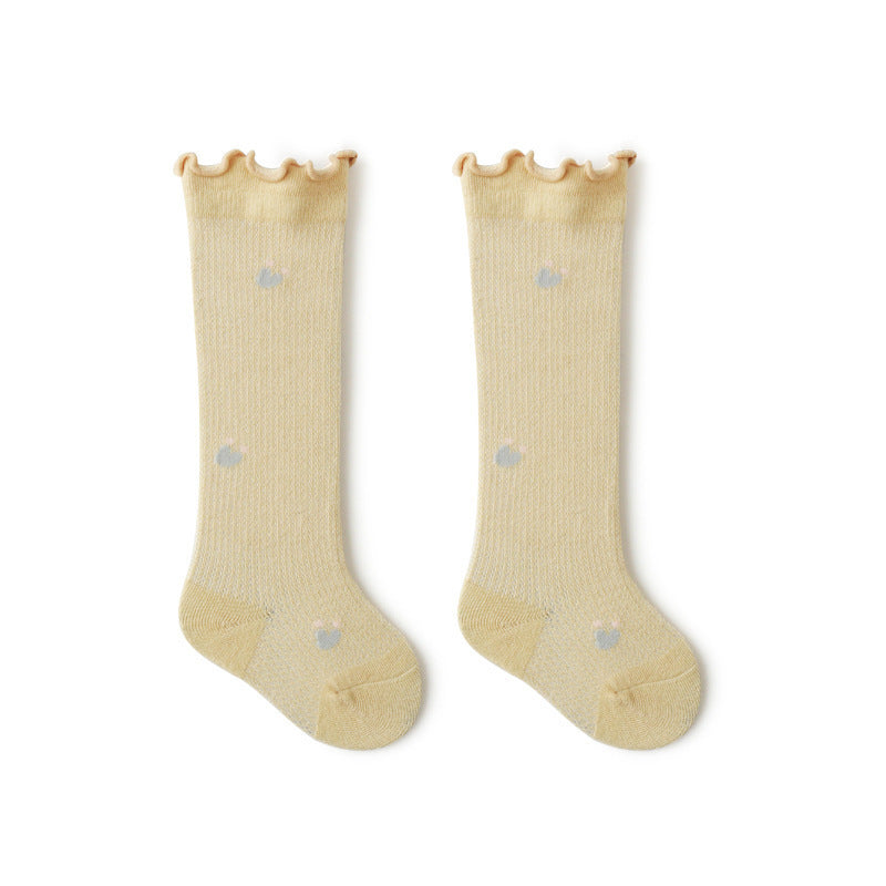 Baby girl knee socks with floral embroidery in various solid colors, made from breathable cotton.