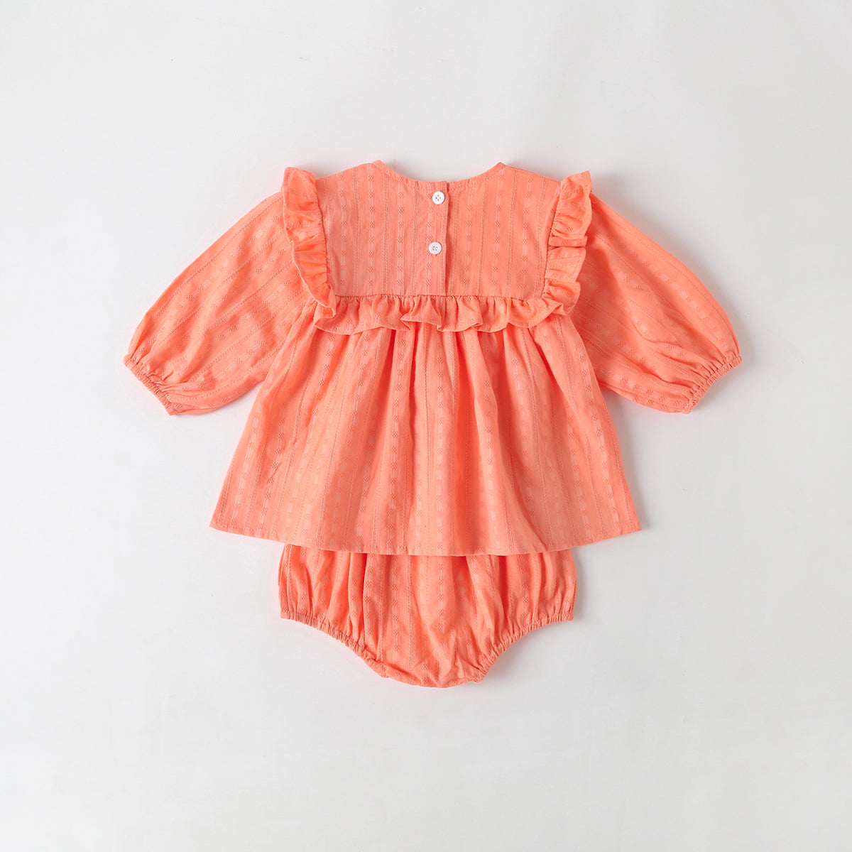 Baby girl outfit featuring solid color long-sleeve tops with frill trim and triangle shorts in pink and beige.