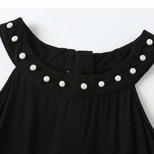 A stylish baby girl dress featuring a halter neck design and an irregular tiered hem in solid black color, perfect for summer occasions.