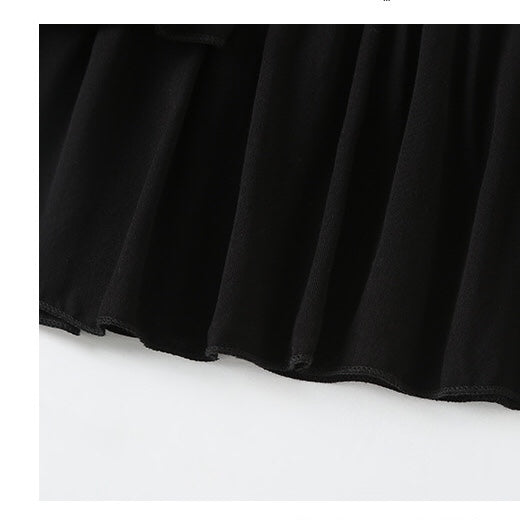 A stylish baby girl dress featuring a halter neck design and an irregular tiered hem in solid black color, perfect for summer occasions.