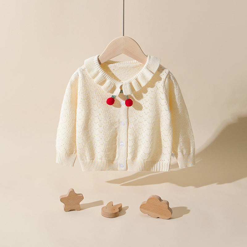 Baby girl cardigan in solid color with hollow carved design and cherry patches, perfect for spring and autumn wear.