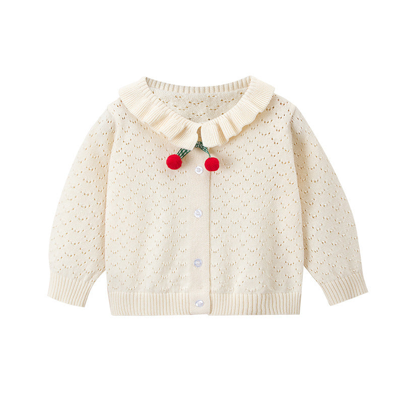 Baby girl cardigan in solid color with hollow carved design and cherry patches, perfect for spring and autumn wear.