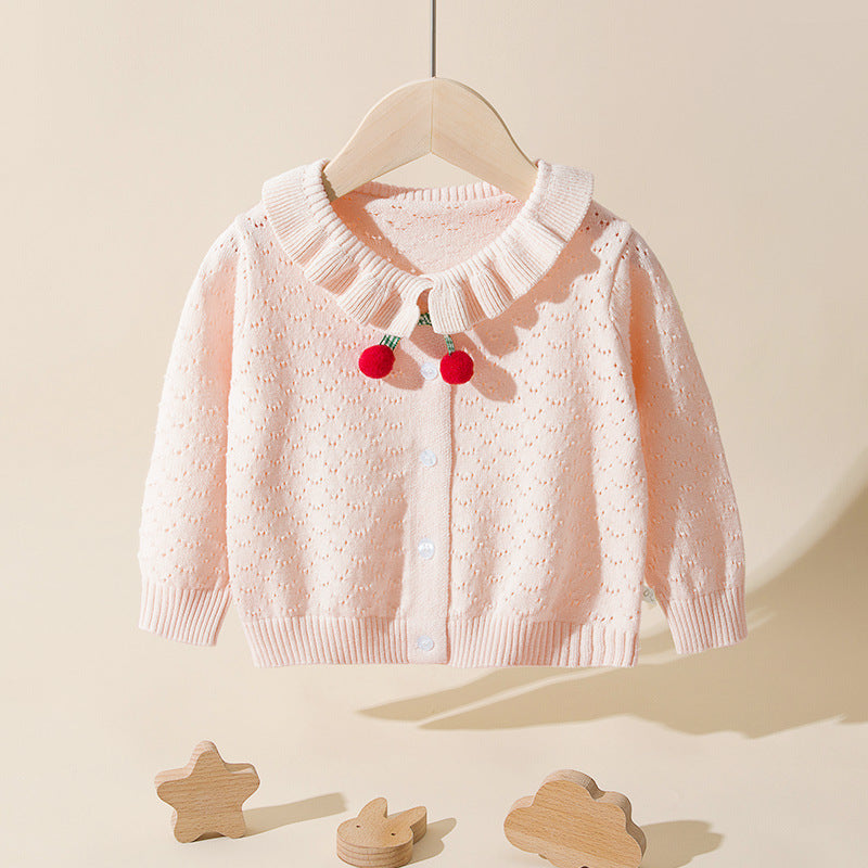 Baby girl cardigan in solid color with hollow carved design and cherry patches, perfect for spring and autumn wear.