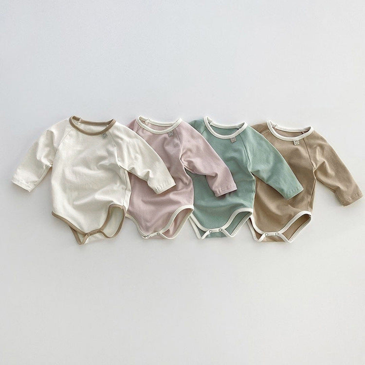 Baby girl bodysuit in solid pink and apricot colors, featuring long sleeves and soft cotton material, perfect for comfort and style.