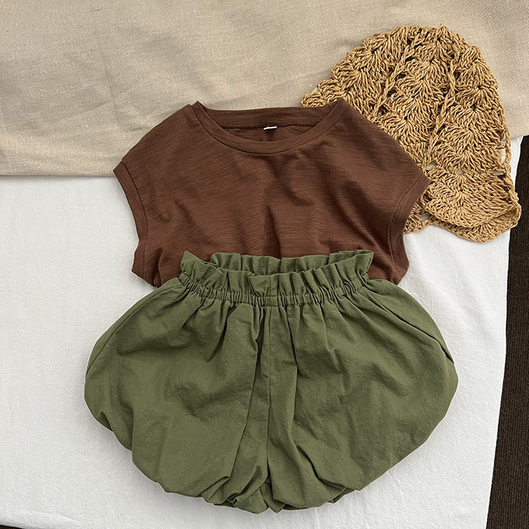 Baby girl solid color loose soft cotton shorts in green and brown, perfect for summer wear.