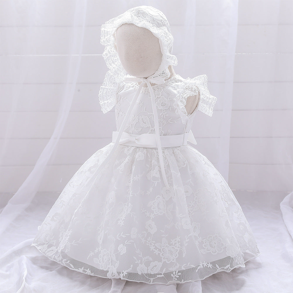 Baby girl dress with solid color mesh overlay and matching hat, perfect for formal occasions like baptisms and birthdays.