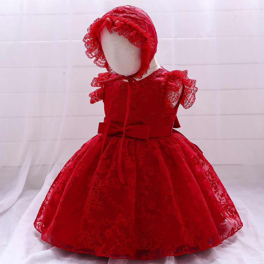 Baby girl dress with solid color mesh overlay and matching hat, perfect for formal occasions like baptisms and birthdays.
