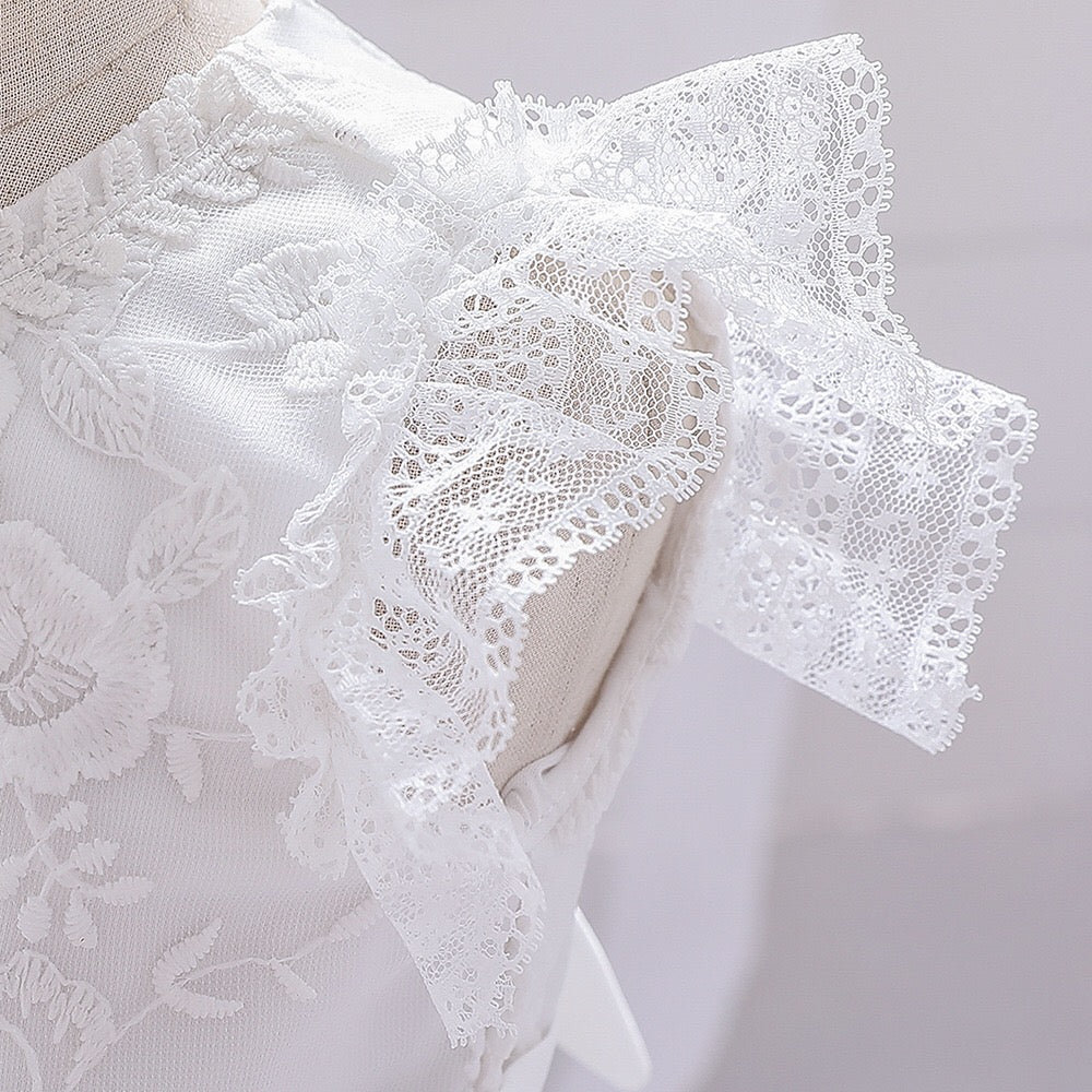 Baby girl dress with solid color mesh overlay and matching hat, perfect for formal occasions like baptisms and birthdays.