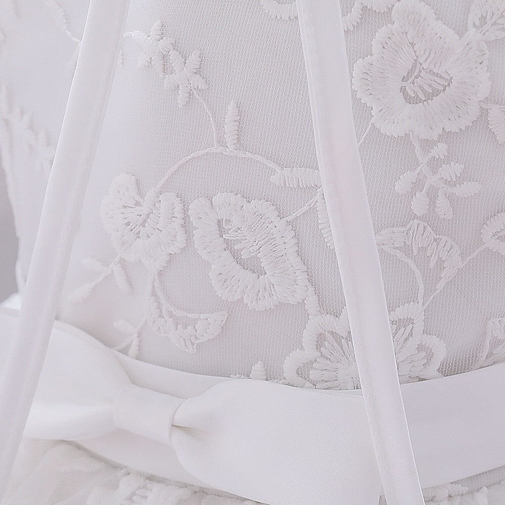 Baby girl dress with solid color mesh overlay and matching hat, perfect for formal occasions like baptisms and birthdays.