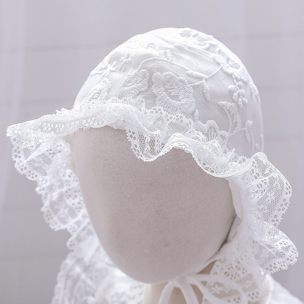 Baby girl dress with solid color mesh overlay and matching hat, perfect for formal occasions like baptisms and birthdays.