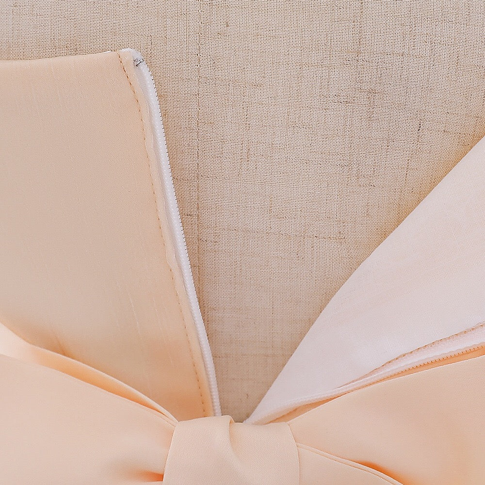 Baby girl wearing a solid color one shoulder tutu dress in white, perfect for formal occasions like baptisms.