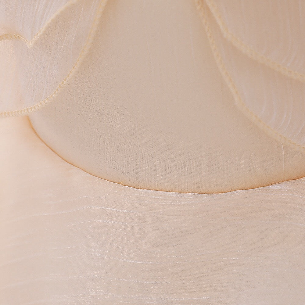 Baby girl wearing a solid color one shoulder tutu dress in white, perfect for formal occasions like baptisms.