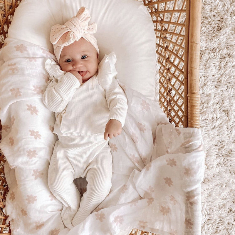 A two-piece baby girl outfit featuring a solid color long sleeve top and matching pants made from pure cotton, available in white, pink, khaki, and brown.