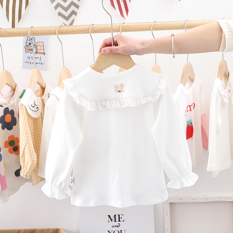 Baby girl solid color shirt with rabbit print and doll-neck collar, perfect for summer wear.