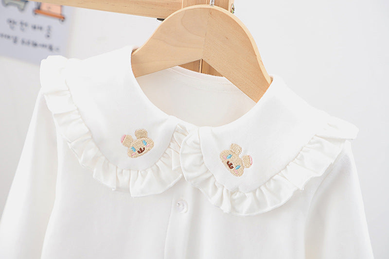 Baby girl solid color shirt with rabbit print and doll-neck collar, perfect for summer wear.
