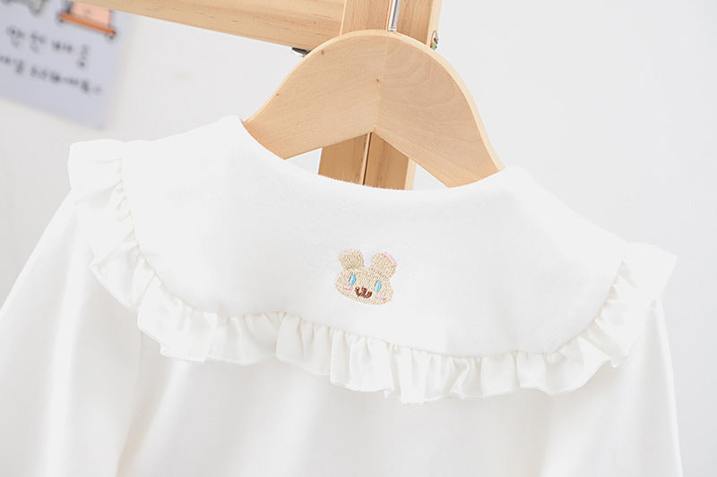 Baby girl solid color shirt with rabbit print and doll-neck collar, perfect for summer wear.