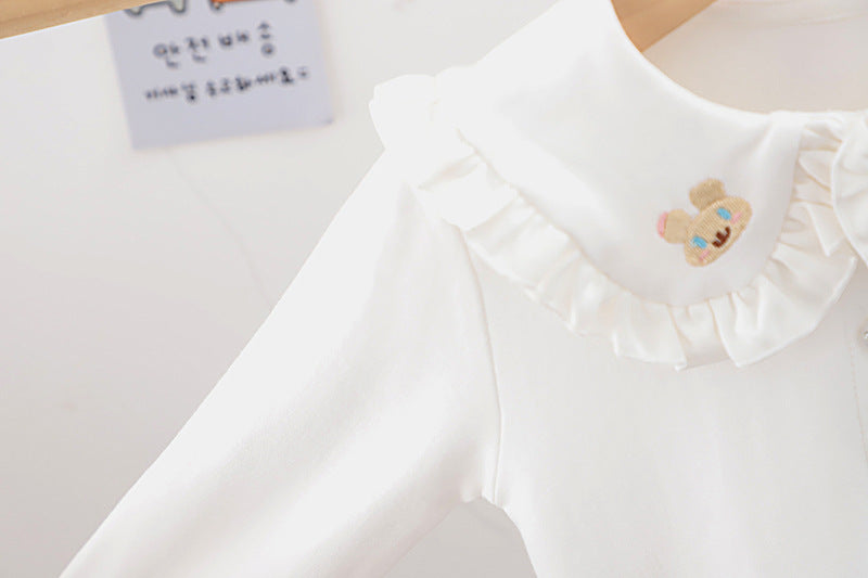 Baby girl solid color shirt with rabbit print and doll-neck collar, perfect for summer wear.