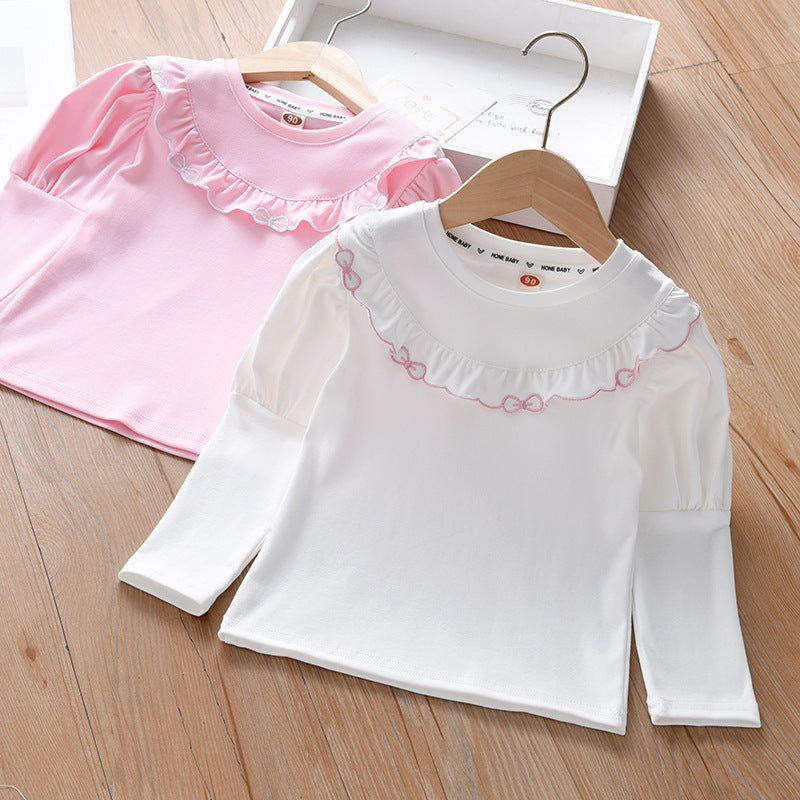 Baby Girl Solid Color Ruffle Design Shirt in white and pink, showcasing ruffle details and soft cotton fabric.