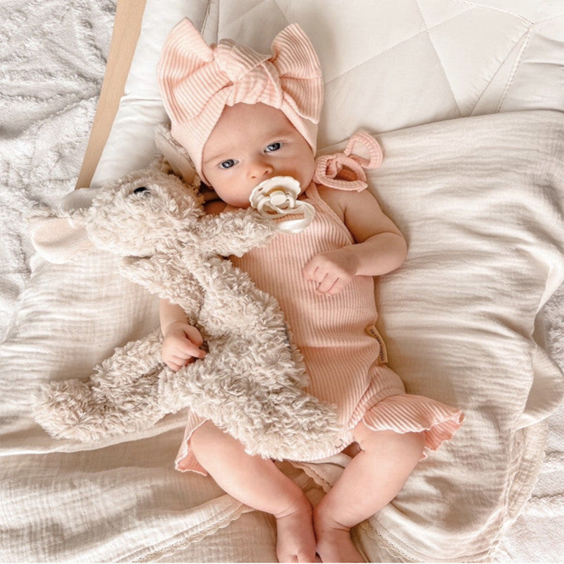 Baby girl solid color sleeveless square neck onesies in white, pink, and khaki, showcasing elegant design and soft cotton fabric.