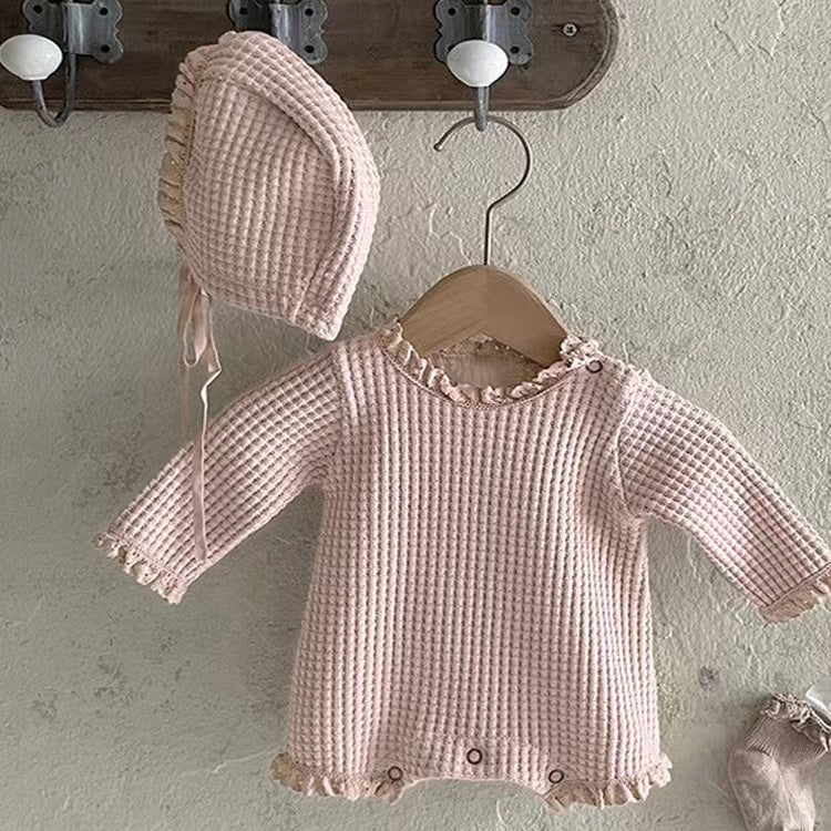 Baby girl bodysuit in solid color with waffle pattern and lace design, featuring long sleeves and triangle cut.