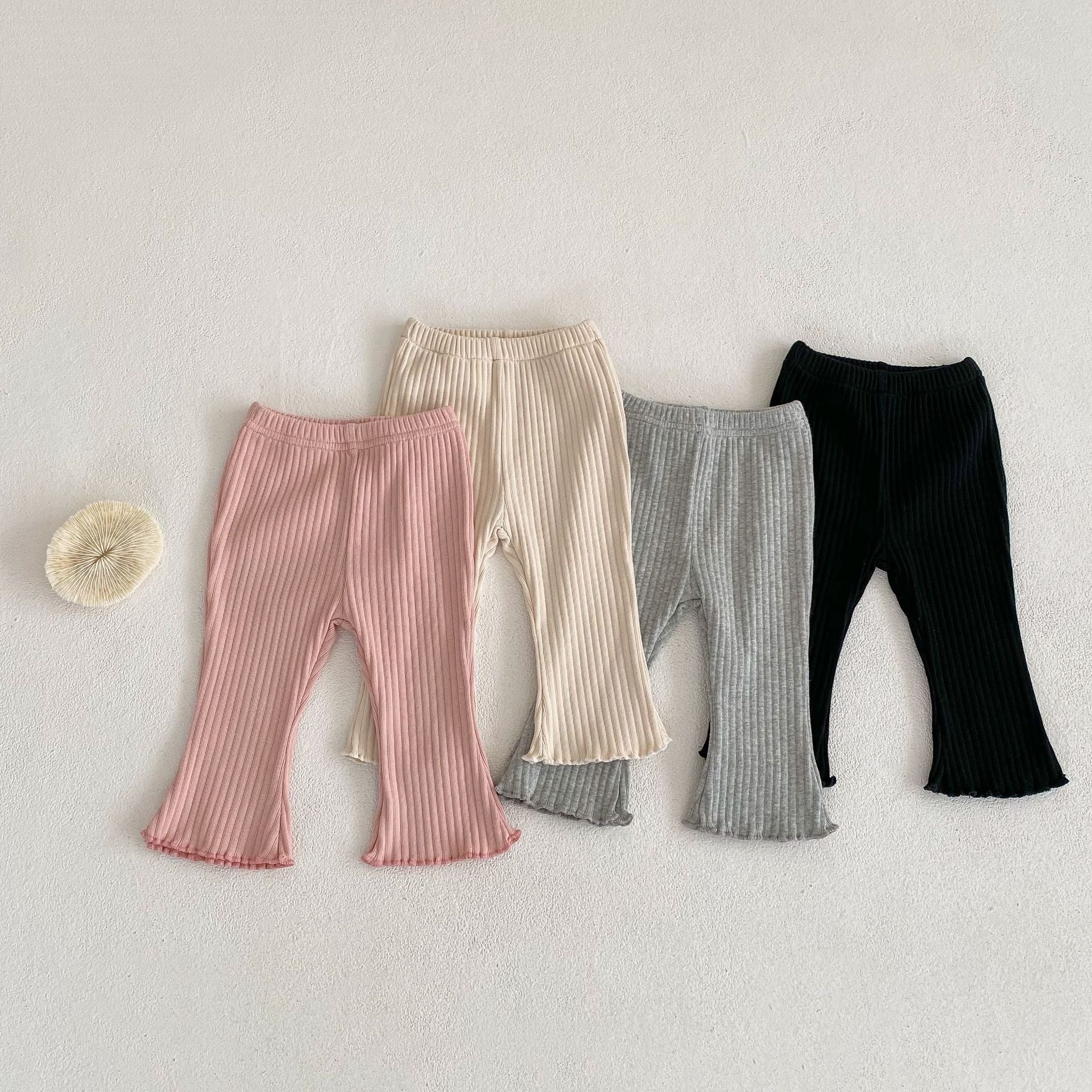 Baby girl soft cotton pants featuring a unique wooden ear design in solid colors.