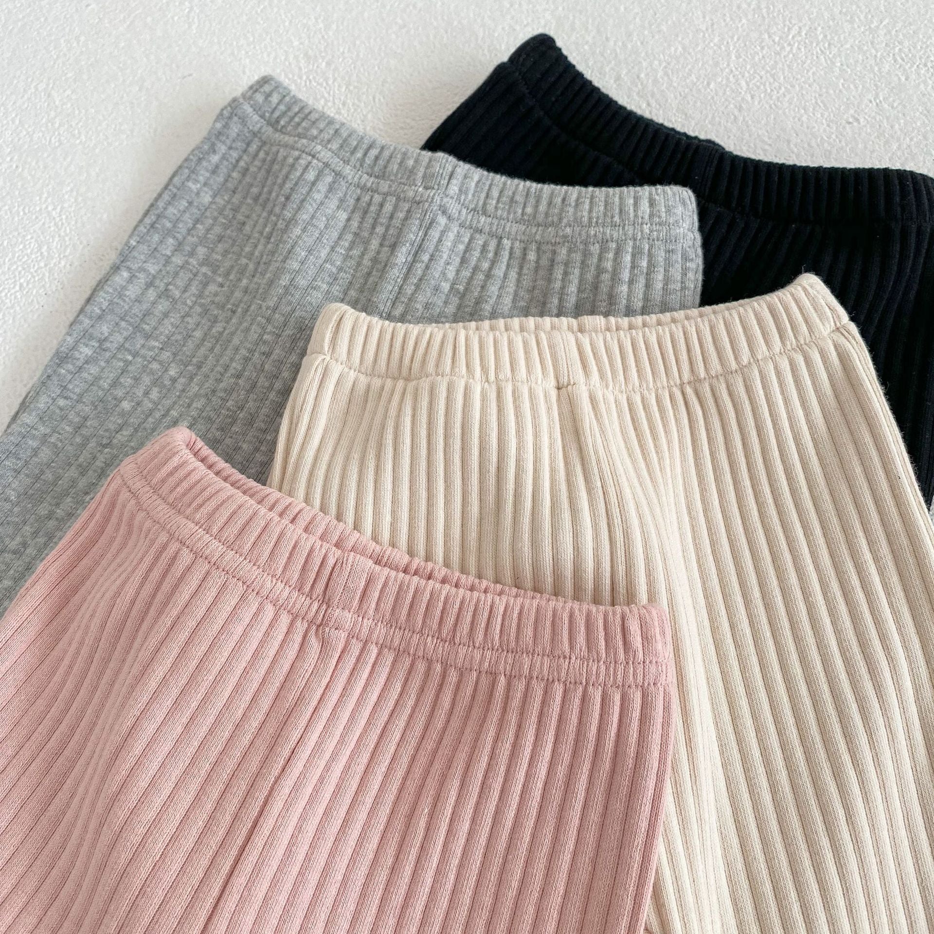 Baby girl soft cotton pants featuring a unique wooden ear design in solid colors.