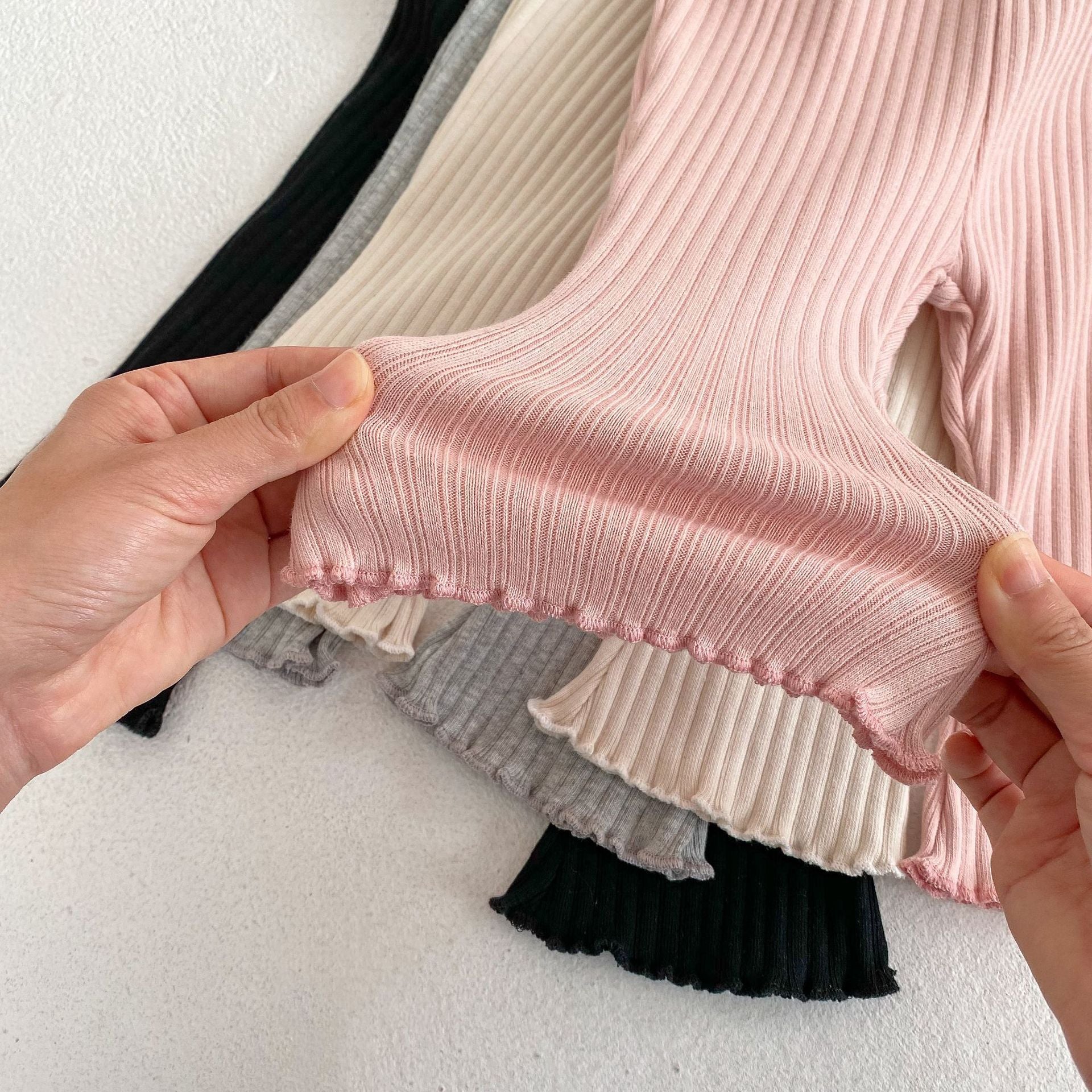 Baby girl soft cotton pants featuring a unique wooden ear design in solid colors.