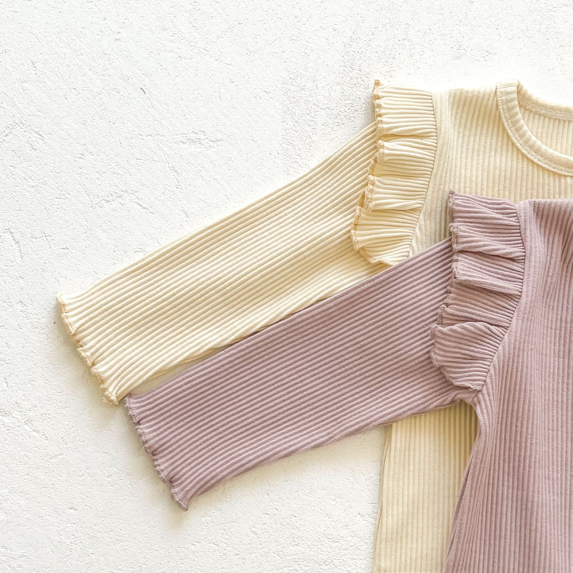 Baby girl solid pit bar long romper in purple with matching hat, showcasing a stylish long silhouette made from soft cotton fabric.