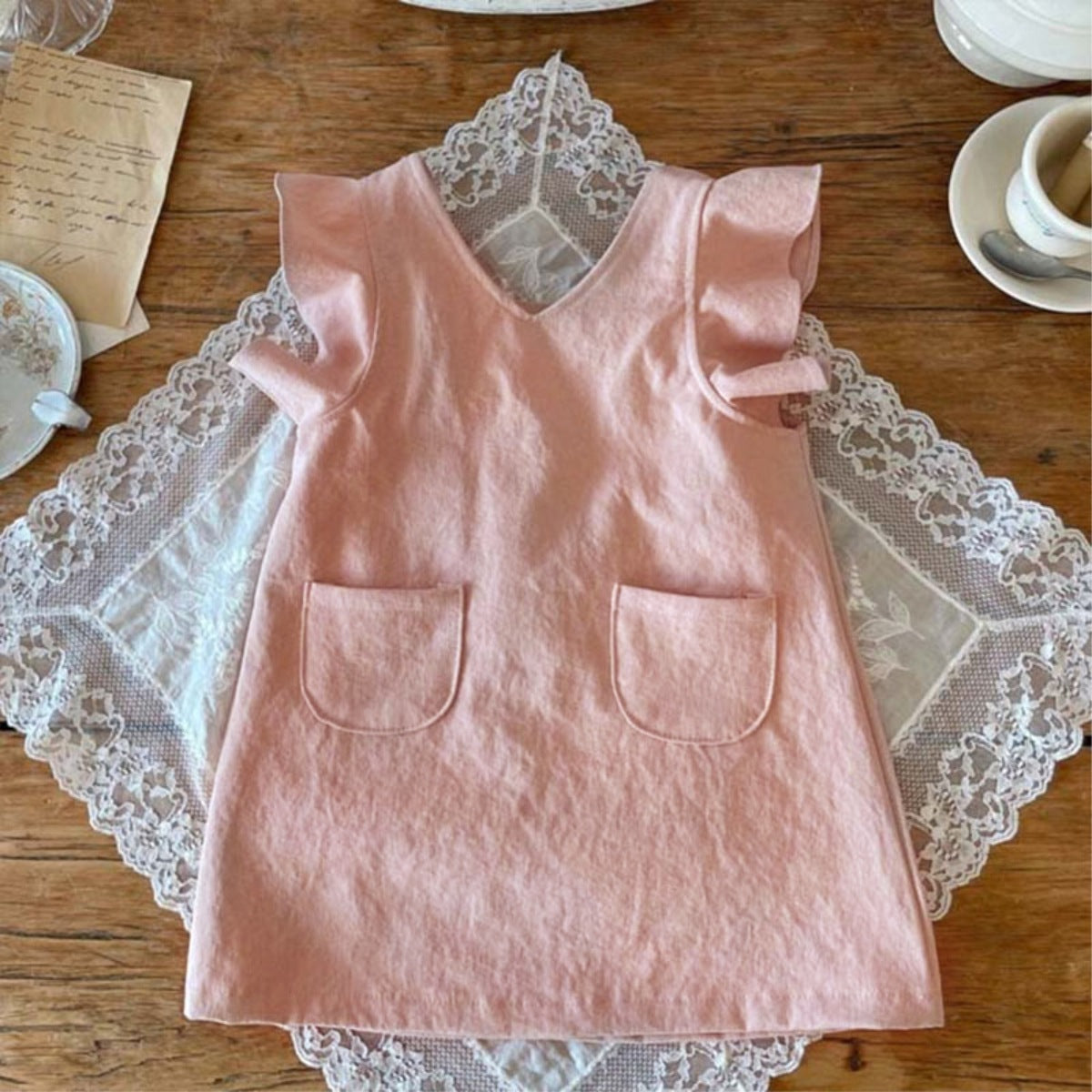 Baby Girl Solid V-Collars Combo Pockets Design Dress in pink and beige, featuring a stylish V-collar and convenient pockets.